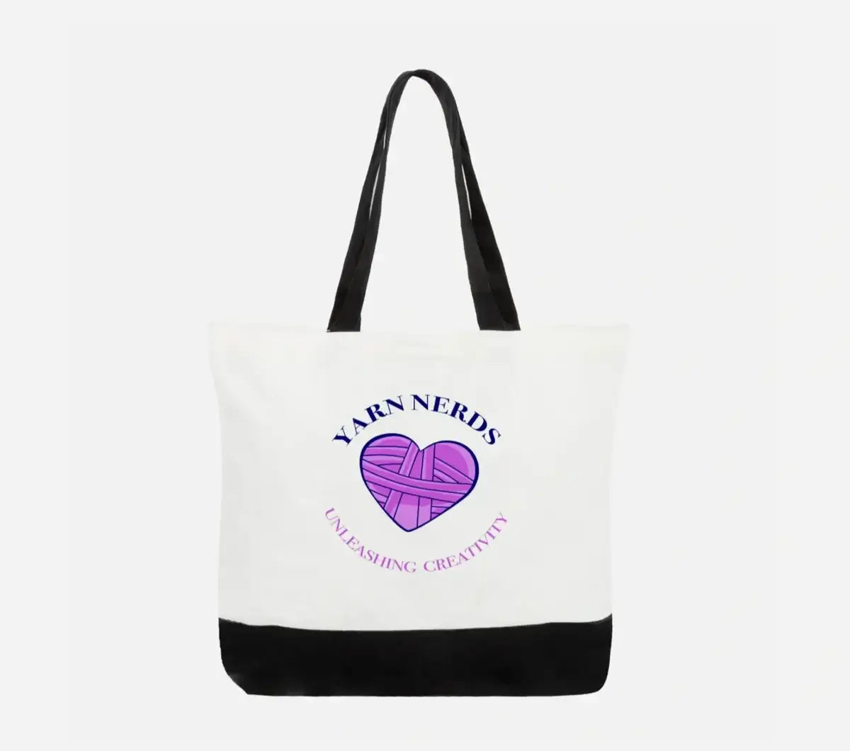 This cotton tote bag, with black handles and bottom, showcases a purple heart-shaped yarn ball on the front. Yarn Nerds Unleashing Creativity circles it in vibrant blue and purple. Perfect for carrying knitting supplies, the design pops against its white 